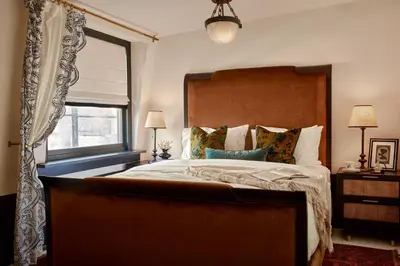 a bedroom with a large bed and a window at Guild House Hotel in Philadelphia