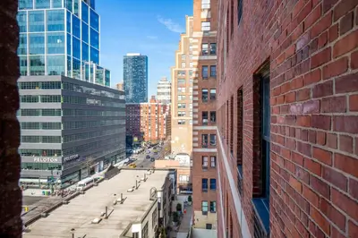 a view of a city street from a brick building at Chelsea 1BR w Gym Concierge nr Penn Stn MSG NYC-439 in New York