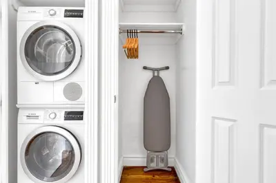 a room with two washing machines and a tie at W Village 1BR w Elevator WD nr subway NYC-762 in New York