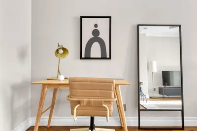 a desk with a chair and a mirror at W Village 1BR w Elevator WD nr subway NYC-762 in New York