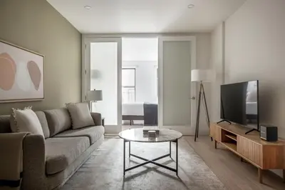 a living room with a couch and a tv at East Village 1br w wd nr Union Sq NYC-938 in New York