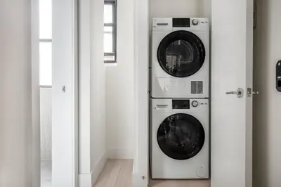 two washer and dryer machines in a room at East Village 1br w wd nr Union Sq NYC-938 in New York