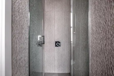 a shower with a glass door in a bathroom at East Village 1br w wd nr Union Sq NYC-938 in New York