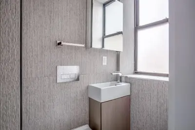 a bathroom with a sink and a mirror at East Village 1br w wd nr Union Sq NYC-938 in New York