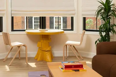 a yellow table and chairs in a living room at YOWIE Hotel in Philadelphia