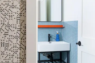 a bathroom with a white sink and a shower at YOWIE Hotel in Philadelphia