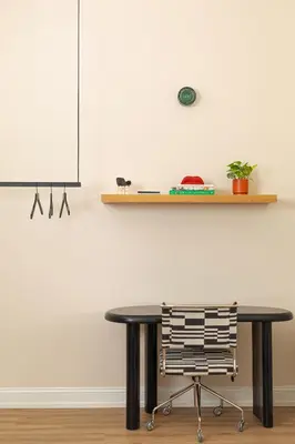 a black table and a chair in a room at YOWIE Hotel in Philadelphia