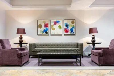 a living room with a couch and two chairs at Chelsea 1BR w Gym Concierge nr Penn Station NYC-438 in New York