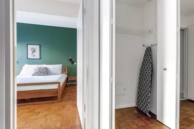a bedroom with a bed and a blue wall at Chelsea 1BR w Gym Concierge nr Penn Station NYC-438 in New York