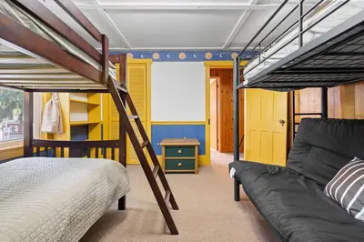a bedroom with two bunk beds and a couch at Entire House within Campground in Mifflinburg