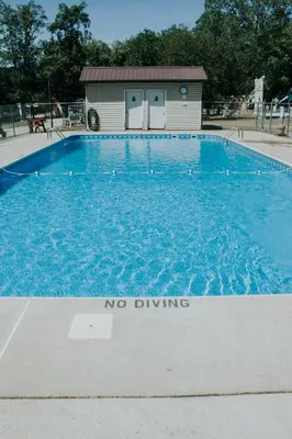 a no driving sign in front of a swimming pool at Cozy Cabin2 Within Campground in Mifflinburg