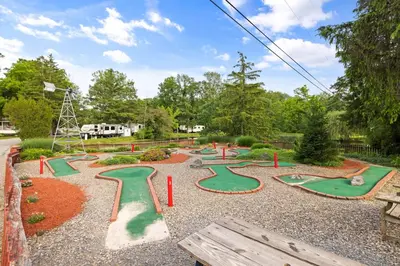 a playground with a bunch of mini golf courses at Cozy Cabin4 Within Campground in Mifflinburg