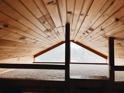 a large wooden ceiling in a room with a window at Deluxe Cabin6 Within Campground in Mifflinburg
