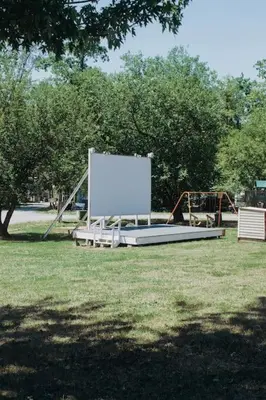 a large white screen on a playground in a park at Deluxe Cabin7 Within Campground in Mifflinburg