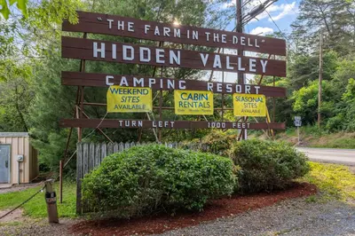 a sign for the fair in the bell hidden valley at Deluxe Cabin7 Within Campground in Mifflinburg