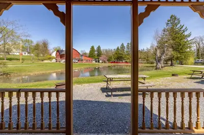 a view of a lake from a gazebo at Cozy Cabin3 Within Campground in Mifflinburg