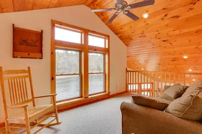 a living room with a couch and a window at Pet-Friendly Hancock Home on the Delaware River! in Starlight