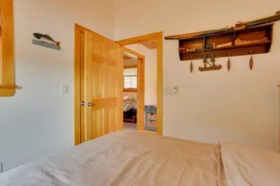 a bedroom with a bed and an open door at Pet-Friendly Hancock Home on the Delaware River! in Starlight