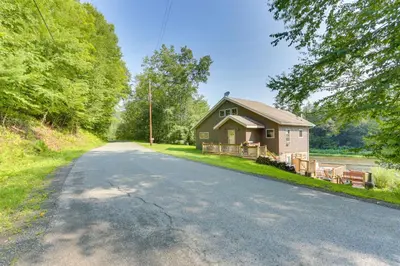 a small house on the side of a road at Pet-Friendly Hancock Home on the Delaware River! in Starlight
