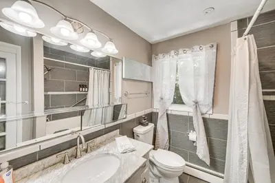 a bathroom with a sink and a toilet and a mirror at 3 Mi to Lake Redman Home with Furnished Pergola! in York