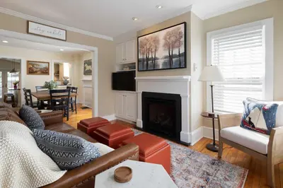 a living room with a couch and a fireplace at Brooke House In The Heart of Downtown with Patio! in Lambertville