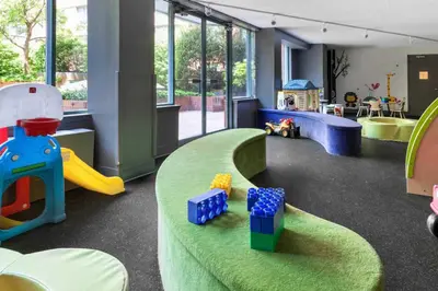 a childrens play area with toys in a room at UWS 1BR w Doorman Gym Parking nr Central Park NYC-596 in New York