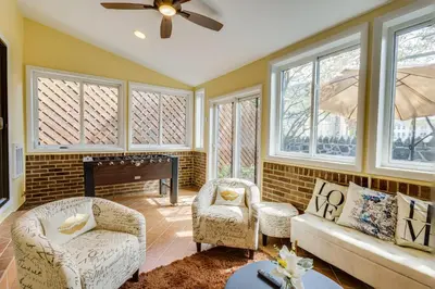 a living room with two chairs and a fireplace at Wilmington Vacation Rental Less Than 2 Mi to Downtown! in Wilmington