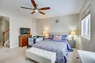 a bedroom with a bed and a ceiling fan at Wilmington Vacation Rental Less Than 2 Mi to Downtown! in Wilmington