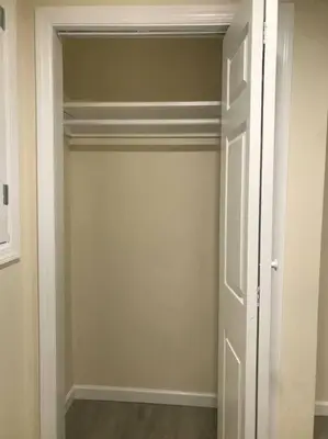 a room with a closet with a white door at Quite and Spacious Apartment in Elizabeth