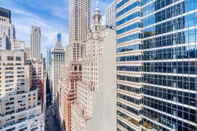 a view of a city with many tall buildings at FiDi 1br w lounge gym nr Freedom Tower NYC-1138 in New York