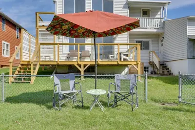 a table and two chairs and an umbrella at Scenic Home on the Delaware River, Pet-Friendly! in Starlight