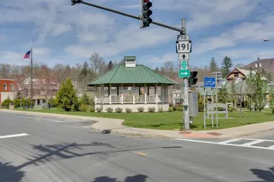 a traffic light at an intersection with a building with a green roof at Scenic Home on the Delaware River, Pet-Friendly! in Starlight
