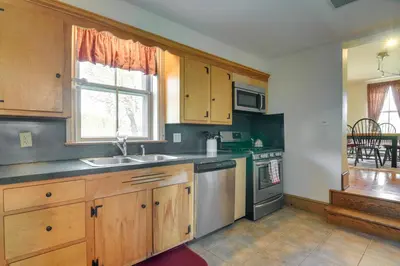 a kitchen with a sink and a stove at Rustic Wellsville Home - 5 Mi to Roundtop Mountain in Wellsville