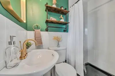 a bathroom with a white toilet and a sink at ‘Scenic Escapes’ Romantic Pine Grove Getaway! in Pine Grove