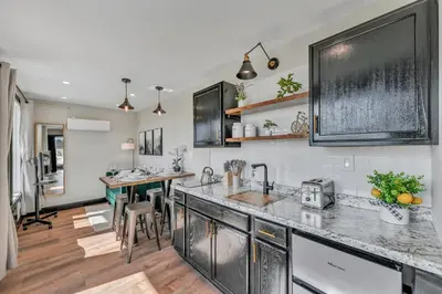 a kitchen with stainless steel cabinets and a counter top at ‘Scenic Escapes’ Romantic Pine Grove Getaway! in Pine Grove