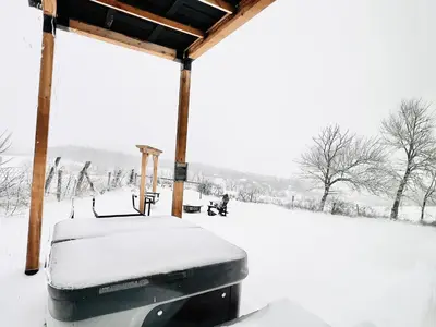 acovered gazebo with snow on the ground at ‘Scenic Escapes’ Romantic Pine Grove Getaway! in Pine Grove