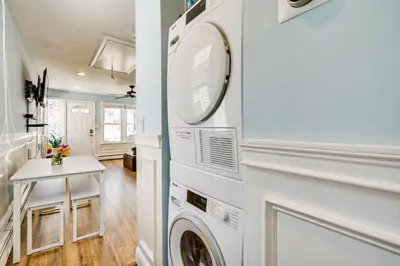 a laundry room with a washer and dryer at New Jersey Abode - Near Theme Parks, Walk to Beach in Keansburg
