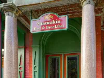 a sign on the side of a building at Shamokin Bed and Breakfast in Shamokin