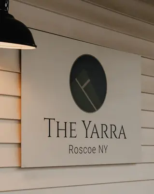 a sign on the side of a building at The Yarra in Roscoe
