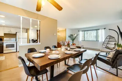 a dining room and living room with a table and chairs at Serene Pocono Pines Home 2 Mi to Lake Naomi Beach in Pocono Pines