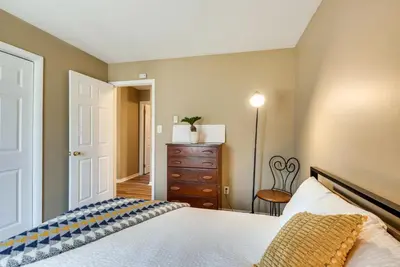 a bedroom with a bed and a dresser and a chair at Serene Pocono Pines Home 2 Mi to Lake Naomi Beach in Pocono Pines