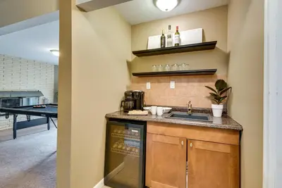 a kitchen with a sink and a counter top at Serene Pocono Pines Home 2 Mi to Lake Naomi Beach in Pocono Pines