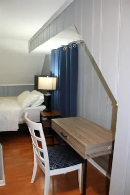 a bedroom with a desk and a bed and a desk and a chair at Beautiful place minutes away to New York City . in Teaneck