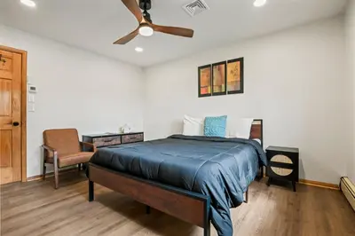 a bedroom with a bed and a ceiling fan at 226 E Shore Dr in East Stroudsburg