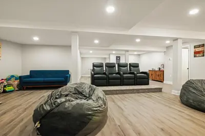 a waiting room with black leather chairs and a blue couch at 226 E Shore Dr in East Stroudsburg