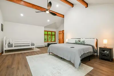 a bedroom with a bed and a ceiling fan at 226 E Shore Dr in East Stroudsburg