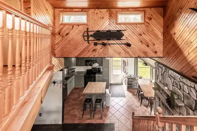 an overhead view of a kitchen and dining room in a house at Waterfront Stagshead Lakehouse at Lake Arrowhead in Arrowhead Lake