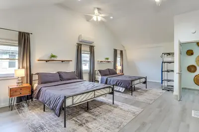 a bedroom with two beds and a ceiling fan at 7 Mi to Whitewater Rafting Cozy Lansford Cabin! in Barnesville