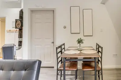 a dining room with a table and chairs at 7 Mi to Whitewater Rafting Cozy Lansford Cabin! in Barnesville