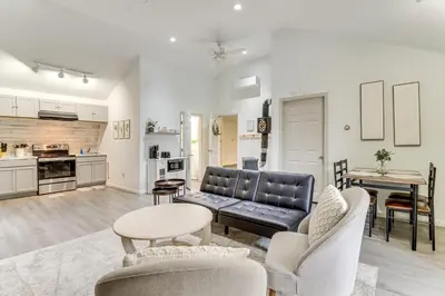a living room with a couch and a table at 7 Mi to Whitewater Rafting Cozy Lansford Cabin! in Barnesville